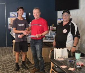 Matt from Sideline Hobbies presenting Ian Wrenford $50 gif voucher with APMA President Carlo Piscicelli