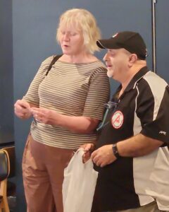 Charmian Travis With Carlo  Piscicelli drawing the raffle.
